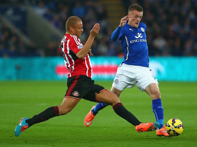Wes Brown of Sunderland tackles Jamie Vardy of Leicester City during the Barclays Premier League match between Leicester City and Sunderland at The King Power Stadium on November 22, 2014