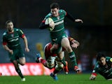 Freddie Burns of Leicester Tigers is tackled by Lachlan McCaffrey of London Welsh during the Aviva Premiership match between London Welsh and Leicester Tigers at Kassam Stadium on November 23, 2014