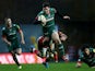 Freddie Burns of Leicester Tigers is tackled by Lachlan McCaffrey of London Welsh during the Aviva Premiership match between London Welsh and Leicester Tigers at Kassam Stadium on November 23, 2014
