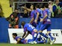 Levante's players celebrate after scoring during the Spanish league football match Levante UD vs Valencia CF at the Ciutat de Valencia stadium in Valencia on November 23, 2014.