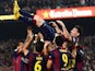 Lionel Messi of FC Barcelona celebrates with his teammates after scoring his team's fourth goal during the La Liga match against Sevilla FC at Camp Nou on November 22, 2014