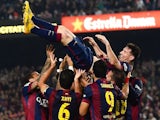 Lionel Messi of FC Barcelona celebrates with his teammates after scoring his team's fourth goal during the La Liga match against Sevilla FC at Camp Nou on November 22, 2014