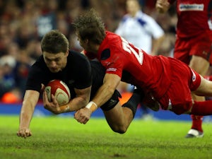 New Zealand's fly half Beauden Barrett runs in a try during the Autumn International rugby union Test match between Wales and New Zealand at the Millennium Stadium in Cardiff, south Wales, on November 22, 2014
