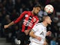 Reims' French forward Gaetan Courtet (R) heads the ball with Nice's French forward Jordan Amavi during the French L1 football match between Nice and Reims at the Allianz Riviera stadium in Nice, southeastern France, on November 22, 2014