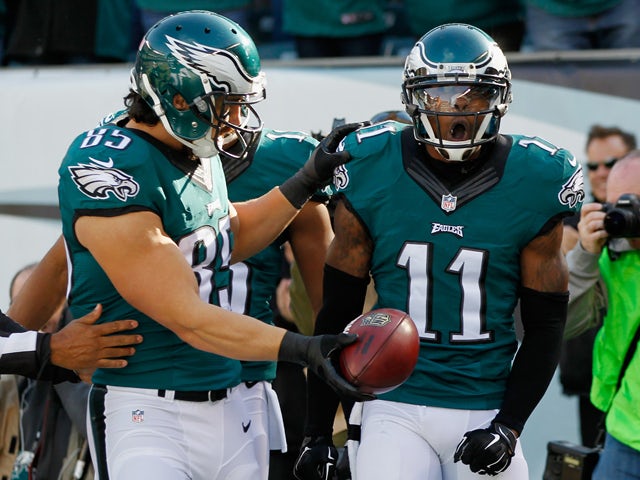 Josh Huff #11 of the Philadelphia Eagles celebrates his touchdown with teammate James Casey #85 in the first quarter against the Tennessee Titans at Lincoln Financial Field on November 23, 2014