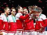Roger Federer of Switzerland, Stanislas Wawrinka of Switzerland , Marco Chiudinelli of Switzerland, Michael Lammer of Switzerland and Captain Severin Luthi of Switzerland celebrate winning the Davis Cup against France during day three of the Davis Cup Ten