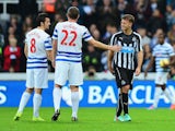 Joey Barton and Richard Dunne of QPR console Ryan Taylor of Newcastle United as he is substituted during the Barclays Premier League match between Newcastle United and Queens Park Rangers at St James' Park on November 22, 2014