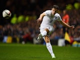 Stewart Downing of England crosses the ball during the International Friendly match between Scotland and England at Celtic Park Stadium on November 18, 2014