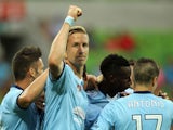 Marc Janko of Sydney celebrates with team-mates after scoring a goal during the round seven A-League match between Melbourne City and Sydney FC at AAMI Park on November 22, 2014 