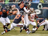 Running back Doug Martin #22 of the Tampa Bay Buccaneers carries the football against free safety Chris Conte #47 of the Chicago Bears in the first quarter at Soldier Field on November 23, 2014