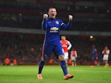 Manchester United's Wayne Rooney celebrates after Arsenal's own goal on November 22, 2014