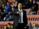 Wigan Athletic Manager Malky Mackay gestures during the Sky Bet Championship match between Wigan Athletic and Middlesbrough at DW Stadium on November 22, 2014