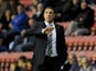 Wigan Athletic Manager Malky Mackay gestures during the Sky Bet Championship match between Wigan Athletic and Middlesbrough at DW Stadium on November 22, 2014