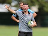 Assistant coach Aaron Mauger gives instuctions during a Crusaders Super Rugby training session at Rugby Park on February 19, 2014