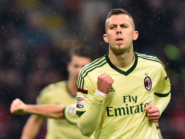 AC Milan's midfielder from France Jeremy Menez celebrates after scoring during the Serie A football match AC Milan vs. Udinese at San Siro Stadium in Milan on November 30, 2014
