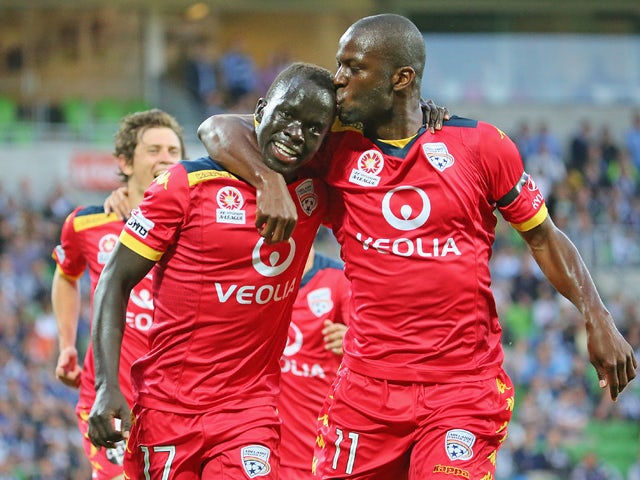 Awer Mabil of United is kissed by Bruce Djite after scoring a goal during the round eight A-League match between Melbourne Victory and Adelaide United at AAMI Park on November 28, 2014