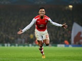 Alexis Sanchez of Arsenal celebrates after scoring his team's second goal during the UEFA Champions League Group D match between Arsenal and Borussia Dortmund at the Emirates Stadium on November 26, 2014