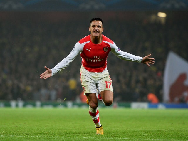 Alexis Sanchez of Arsenal celebrates after scoring his team's second goal during the UEFA Champions League Group D match between Arsenal and Borussia Dortmund at the Emirates Stadium on November 26, 2014