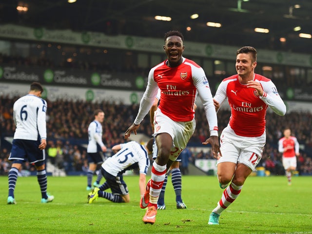 Danny Welbeck of Arsenal celebrates with team mate Olivier Giroud as he scores their first goal during the Barclays Premier League match between West Bromwich Albion and Arsenal at The Hawthorns on November 29, 2014