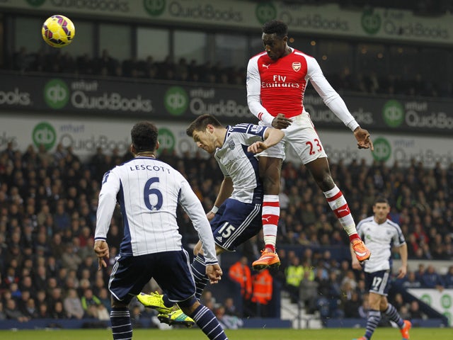 Arsenal's English striker Danny Welbeck jumps to head the opening goal of the English Premier League football match between West Bromwich Albion and Arsenal at The Hawthorns in West Bromwich Albion and Arsenal at The Hawthorns on November 29, 2014