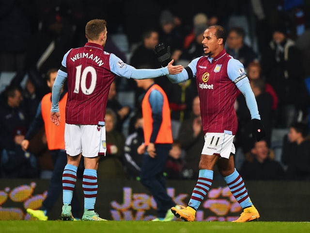 Gabriel Agbonlahor of Aston Villa celebrates with Andreas Weimann as he scores their first goal during the Barclays Premier League match between Aston Villa and Southampton at Villa Park on November 24, 2014