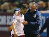 Manager Paul Lambert of Aston Villa speaks with Joe Cole of Aston Villa after he was substituted during the Barclays Premier League match between Burnley and Aston Villa at Turf Moor on November 29, 2014