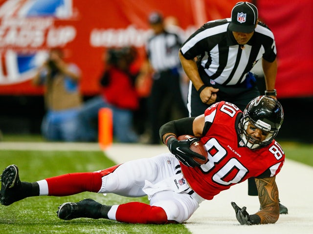 Levine Toilolo #80 of the Atlanta Falcons catches a pass for a touchdown during the first half against the Arizona Cardinals at the Georgia Dome on November 30, 2014 