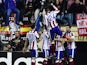 Atletico Madrid's players celebrate their first goal during the UEFA Champions League Group A football match Atletico Madrid vs Olympiakos FC at the Vicente Calderon stadium in Madrid November 26, 2014