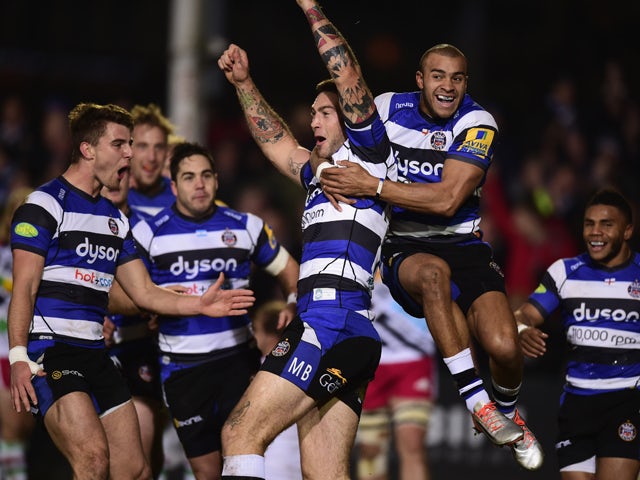 Bath player Matt Banahan celebrates with team mates after scoring the first try during the Aviva Premiership match between Bath Rugby and Harlequins at Recreation Ground on November 28, 2014