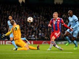 Sebastian Rode of Bayern Muenchen has his shot on goal saved by Joe Hart of Manchester City during the UEFA Champions League Group E match between Manchester City and FC Bayern Muenchen at the Etihad Stadium on November 25, 2014