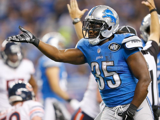 Joique Bell #35 of the Detroit Lions celebrates a second quarter touchdown against the Chicago Bears at Ford Field on November 27 , 2014