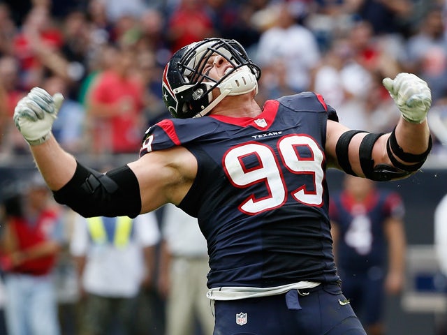 J.J. Watt #99 of the Houston Texans celebrates a sack in the first half of their game against the Tennessee Titans at NRG Stadium on November 30, 2014