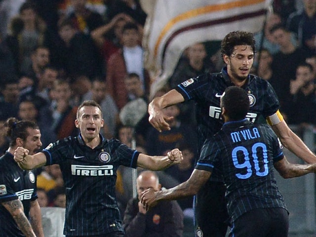 Inter Milan's defender Andrea Ranocchia celebrates after scoring against AS Roma during the Italian Serie A football match between AS Roma and Inter Milan at the Olympic stadium on November 30, 2014