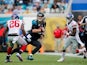 Blake Bortles #5 of the Jacksonville Jaguars carries while defended by Antrel Rolle #26 of the New York Giants during the second quarter of the game at EverBank Field on November 30, 2014