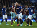 James Collins of West Ham United confronts James McCarthy of Everton during the Barclays Premier League match between Everton and West Ham United at Goodison Park on November 22, 2014