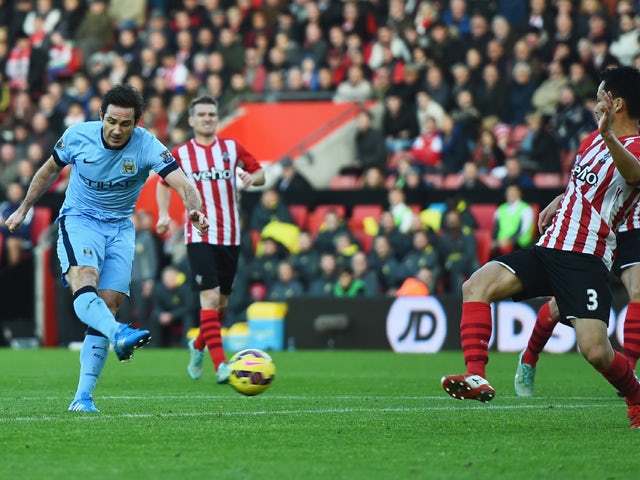  Frank Lampard of Manchester City shoots past Maya Yoshida of Southampton to score their second goal during the Barclays Premier League match between Southampton and Manchester City at St Mary's Stadium on November 30, 2014 