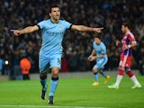 Manchester City's Argentinian striker Sergio Aguero celebrates scoring the opening goal from a penalty kick during the UEFA Champions League Group E football match between Manchester City and Bayern Munich at the Etihad Stadium in Manchester, northwest En