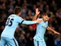 Sergio Aguero of Manchester City celebrates with teammate Stevan Jovetic #35 of Manchester City after scoring his team's second goal during the UEFA Champions League Group E match between Manchester City and FC Bayern Muenchen at the Etihad Stadium on Nov