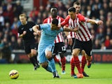Sergio Aguero of Manchester City holds off Jose Fonte of Southampton during the Barclays Premier League match between Southampton and Manchester City at St Mary's Stadium on November 30, 2014 