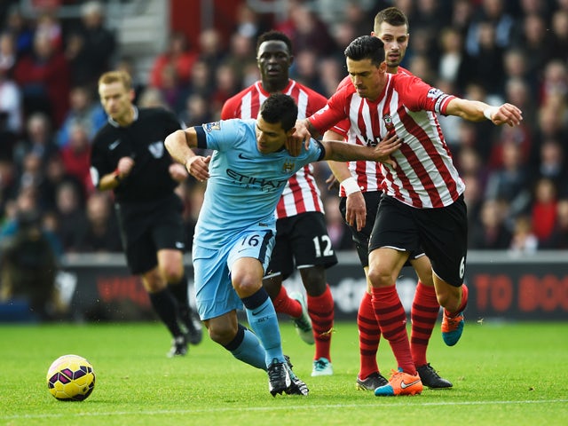 Sergio Aguero of Manchester City holds off Jose Fonte of Southampton during the Barclays Premier League match between Southampton and Manchester City at St Mary's Stadium on November 30, 2014 