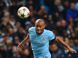 Manchester City's Belgian defender Vincent Kompany heads the ball during the UEFA Champions League Group E football match between Manchester City and Bayern Munich at the Etihad Stadium in Manchester, northwest England, on November 25, 2014