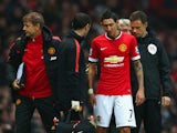 Injured Angel di Maria of Manchester United receives treatment during the Barclays Premier League match between Manchester United and Hull City at Old Trafford on November 29, 2014 