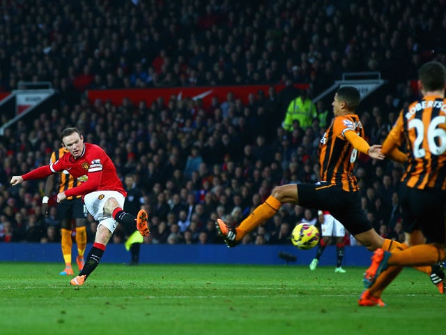 Wayne Rooney of Manchester United scores their second goal during the Barclays Premier League match between Manchester United and Hull City at Old Trafford on November 29, 2014 