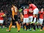 Manchester United players congratulate Manchester United's English defender Chris Smalling after he scores their opening goal of the English Premier League football match between Manchester United and Hull City at Old Trafford in Manchester, north west En
