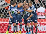 Leigh Broxham of the Victory is congratulated by his teammates after scoring a goal during the round eight A-League match between Melbourne Victory and Adelaide United at AAMI Park on November 28, 2014