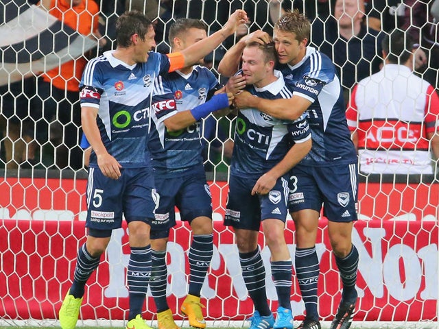 Leigh Broxham of the Victory is congratulated by his teammates after scoring a goal during the round eight A-League match between Melbourne Victory and Adelaide United at AAMI Park on November 28, 2014