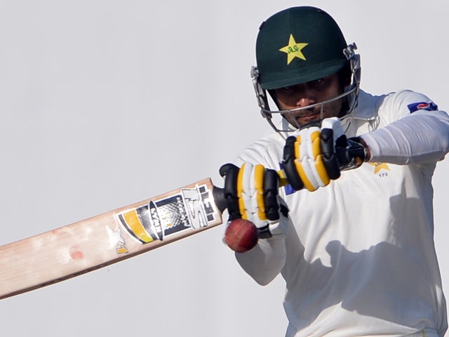 Pakistani batsman Mohammad Hafeez plays a shot during the first day of the third and final Test match between Pakistan and New Zealand at the Sharjah cricket stadium in Sharjah on November 26, 2014