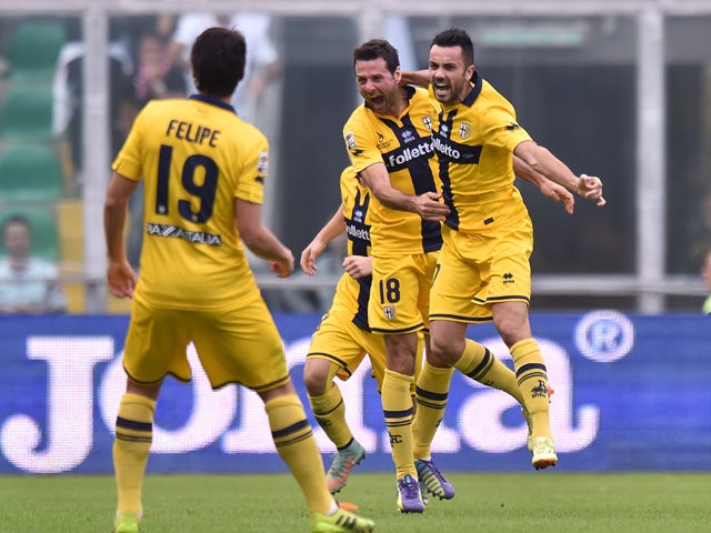 Raffaele Palladino of Parma celebrates with team mates after scoring the equalizing goal during the Serie A match between US Citta di Palermo and Parma FC at Stadio Renzo Barbera on November 30, 2014