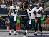 Mark Sanchez #3 of the Philadelphia Eagles is congratulated by Zach Ertz #86 of the Philadelphia Eagles as Andrew Gardner #66 of the Philadelphia Eagles is near after he scored a touchdown against the Dallas Cowboys in the first half at AT&T Stadium on No