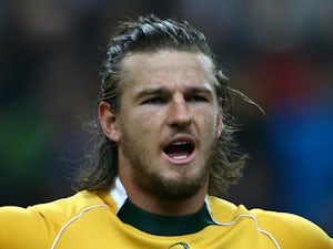 Rob Horne of Australia sings the national anthem during the International match between France and Australia at The Stade De France on November 15, 2014